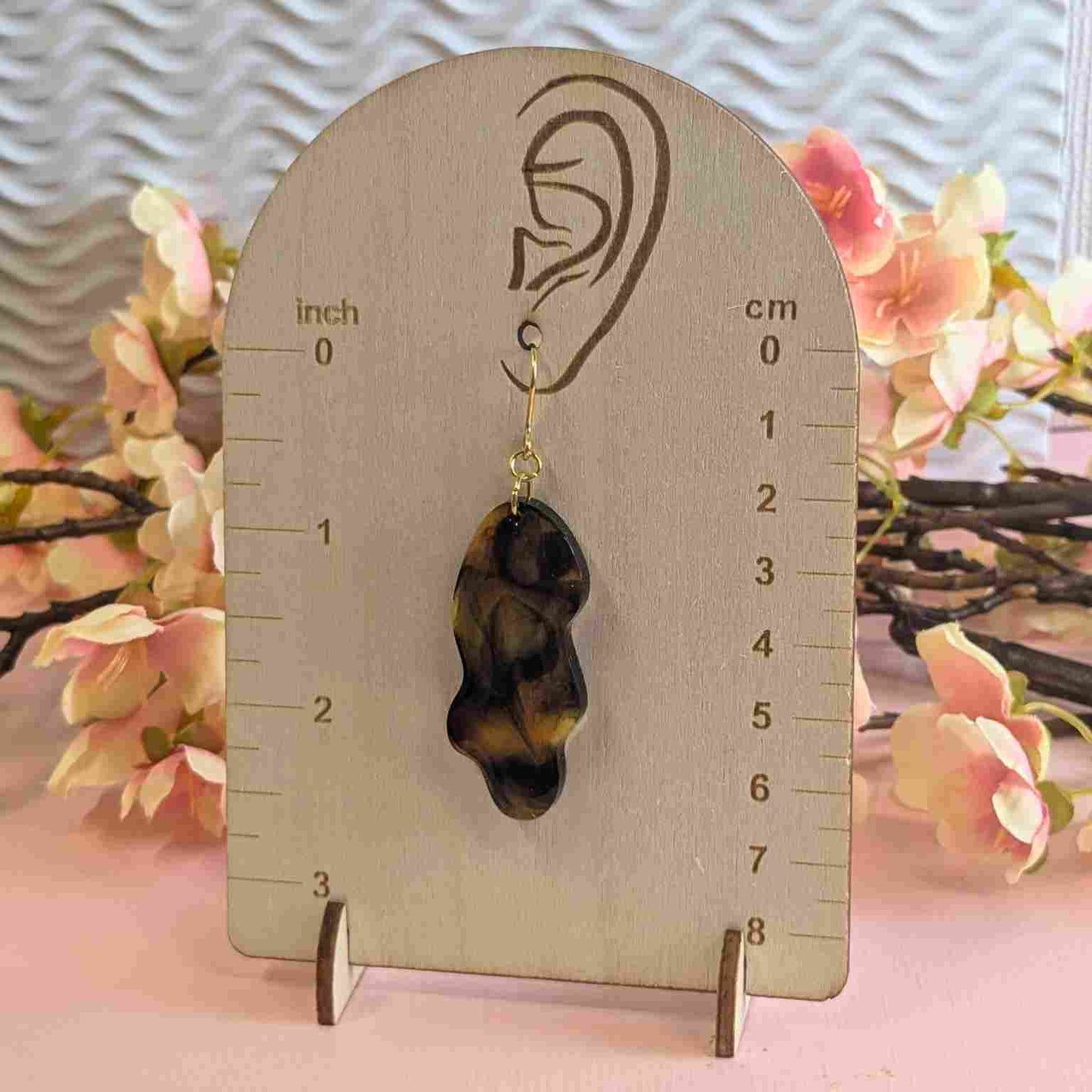 Billie Tortoiseshell Wavy Resin Dangle Earring on wooden measuring guide showing 7cm drop.