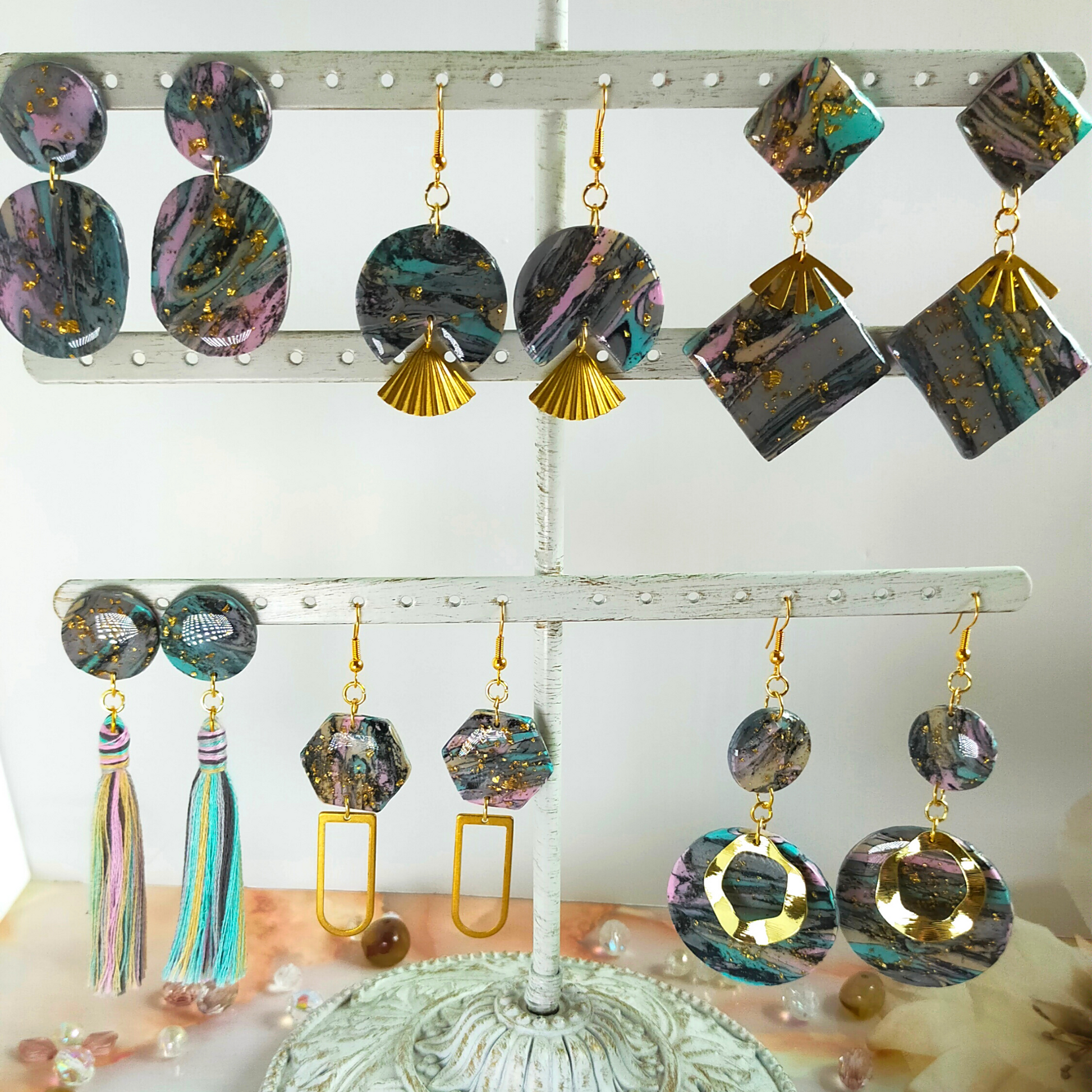Handmade in our West Yorkshire Studio, these unique, one-of-a-kind faux marbled polymer clay earrings with tassel charm are the perfect gift for any stylish women.