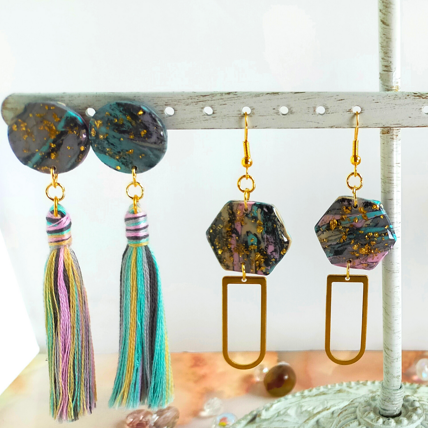 Handmade in our West Yorkshire Studio, these unique, one-of-a-kind faux marbled polymer clay earrings with tassel charm are the perfect gift for any stylish women.