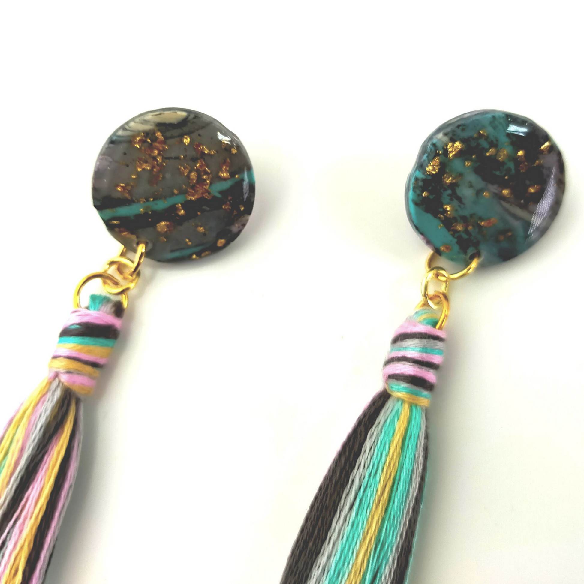 Handmade in our West Yorkshire Studio, these unique, one-of-a-kind faux marbled polymer clay earrings with tassel charm are the perfect gift for any stylish women.