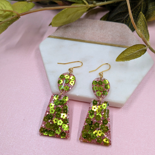 Handmade 'Aria' green flower and pink glitter resin dangle earrings by Created By Lau — bold, one-of-a-kind accessories made in Shipley, West Yorkshire