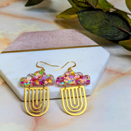 Handmade 'Alma' cloud dot glitter resin dangle earrings with brass rainbow charm by Created By Lau — bold statement earrings for modern brides, made in Shipley, West Yorkshire