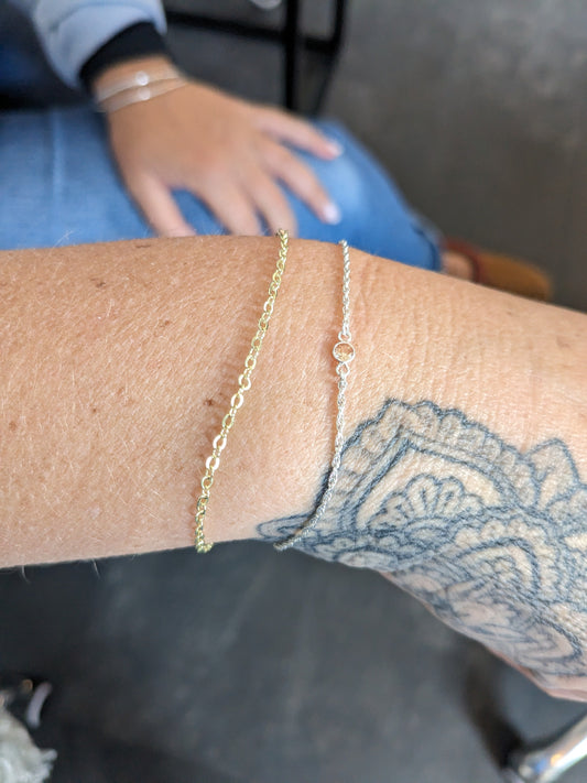 Stacked gold and silver permanent welded bracelets on a wrist with a mandala tattoo — Welded Bonds by Created By Lau, Shipley, West Yorkshire