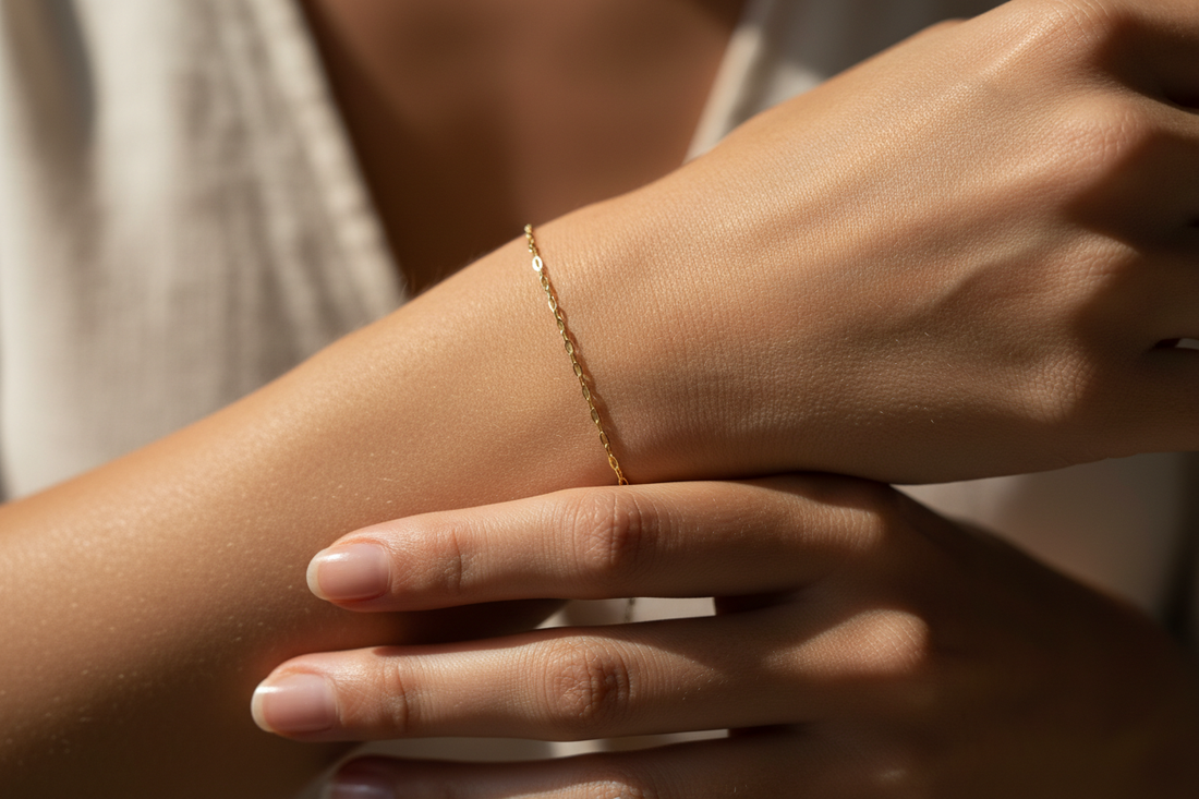 Close-up of a delicate gold permanent welded bracelet on a wrist with no clasp — Welded Bonds by Created By Lau, Shipley, West Yorkshire
