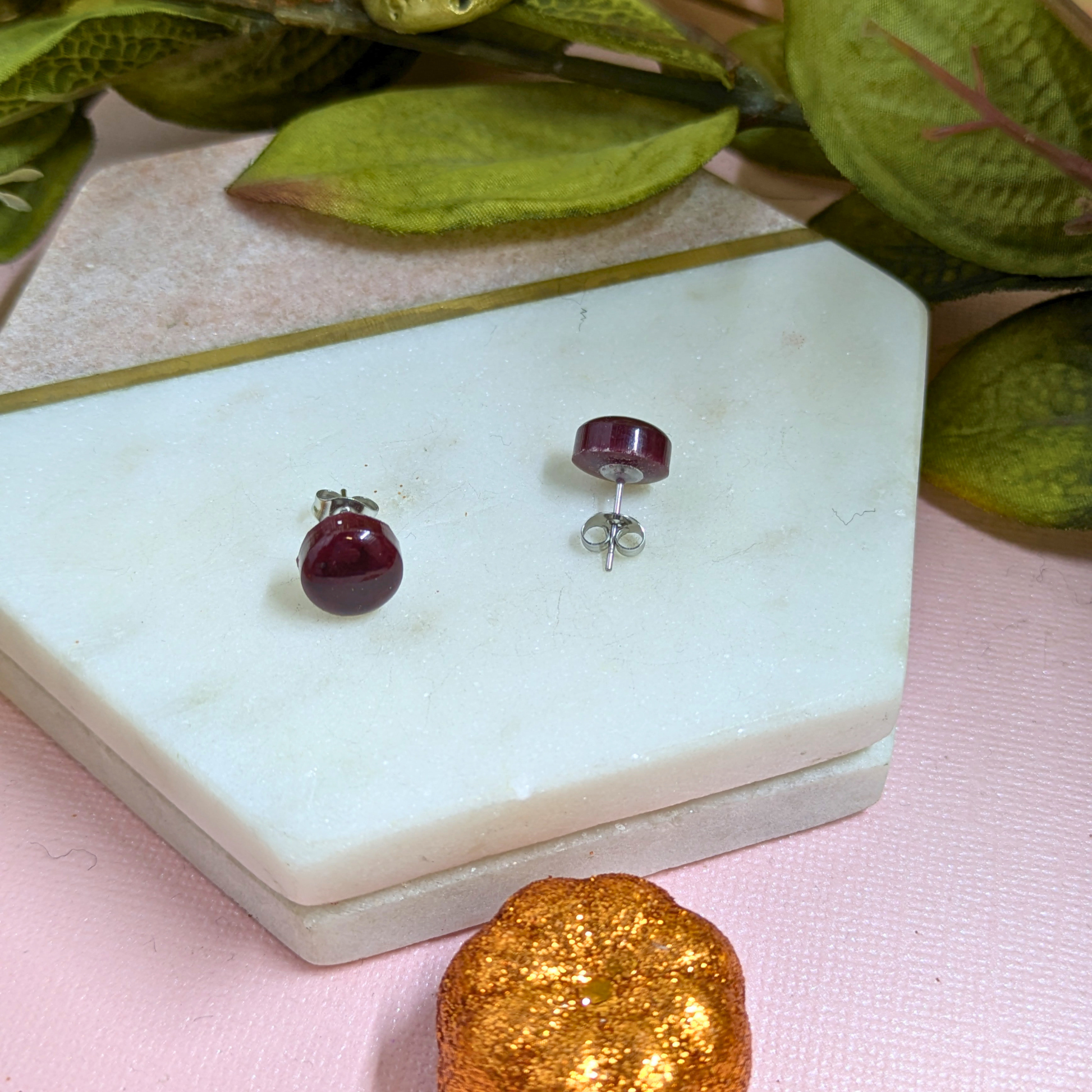 Close-up of Bridget Blood Red resin stud earring showing stainless steel post and scroll fitting — handmade 1cm jewellery by Created By Lau