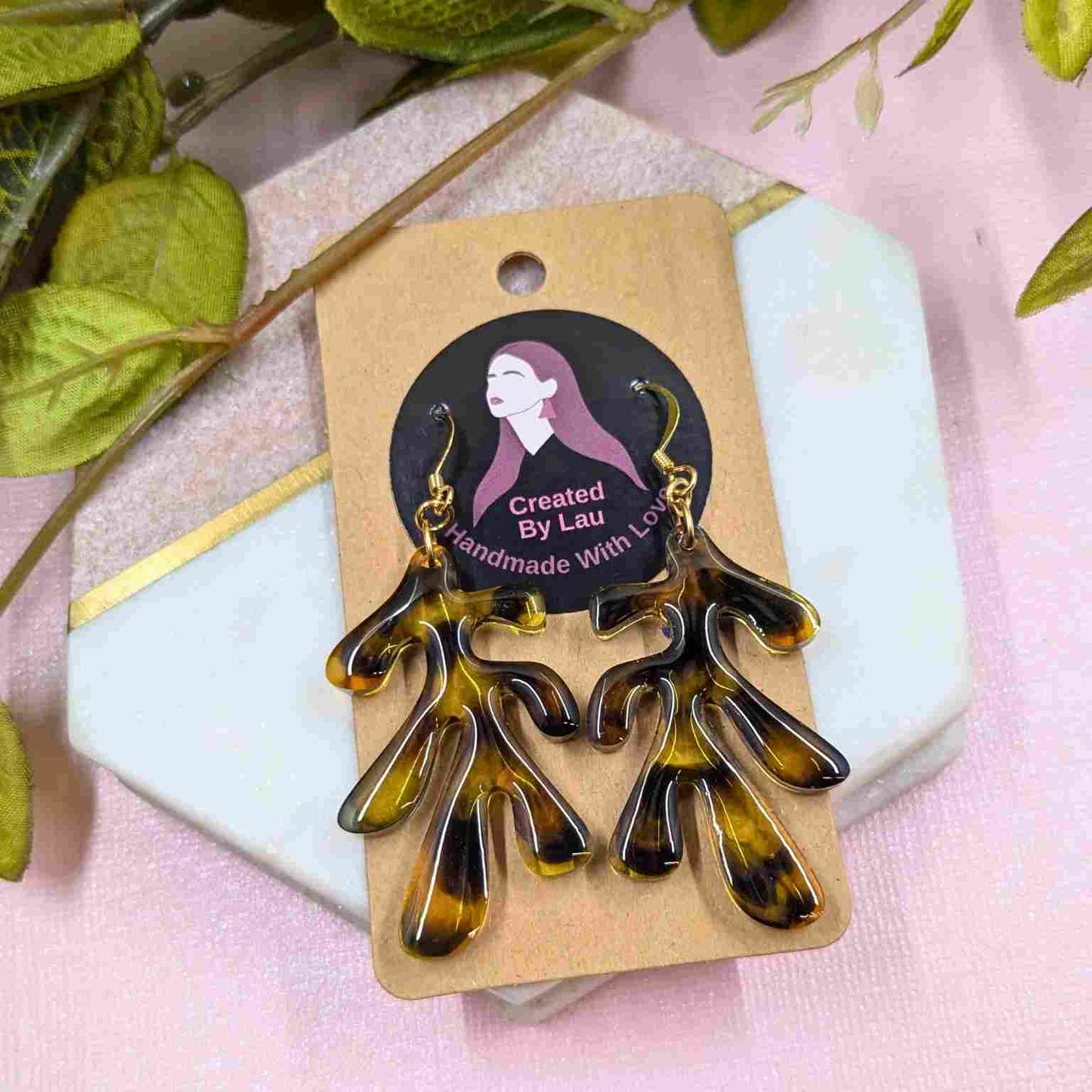 Pair of Dakota Tortoiseshell Resin Organic Leaf Earrings - Gold Plated Hooks on branded packaging