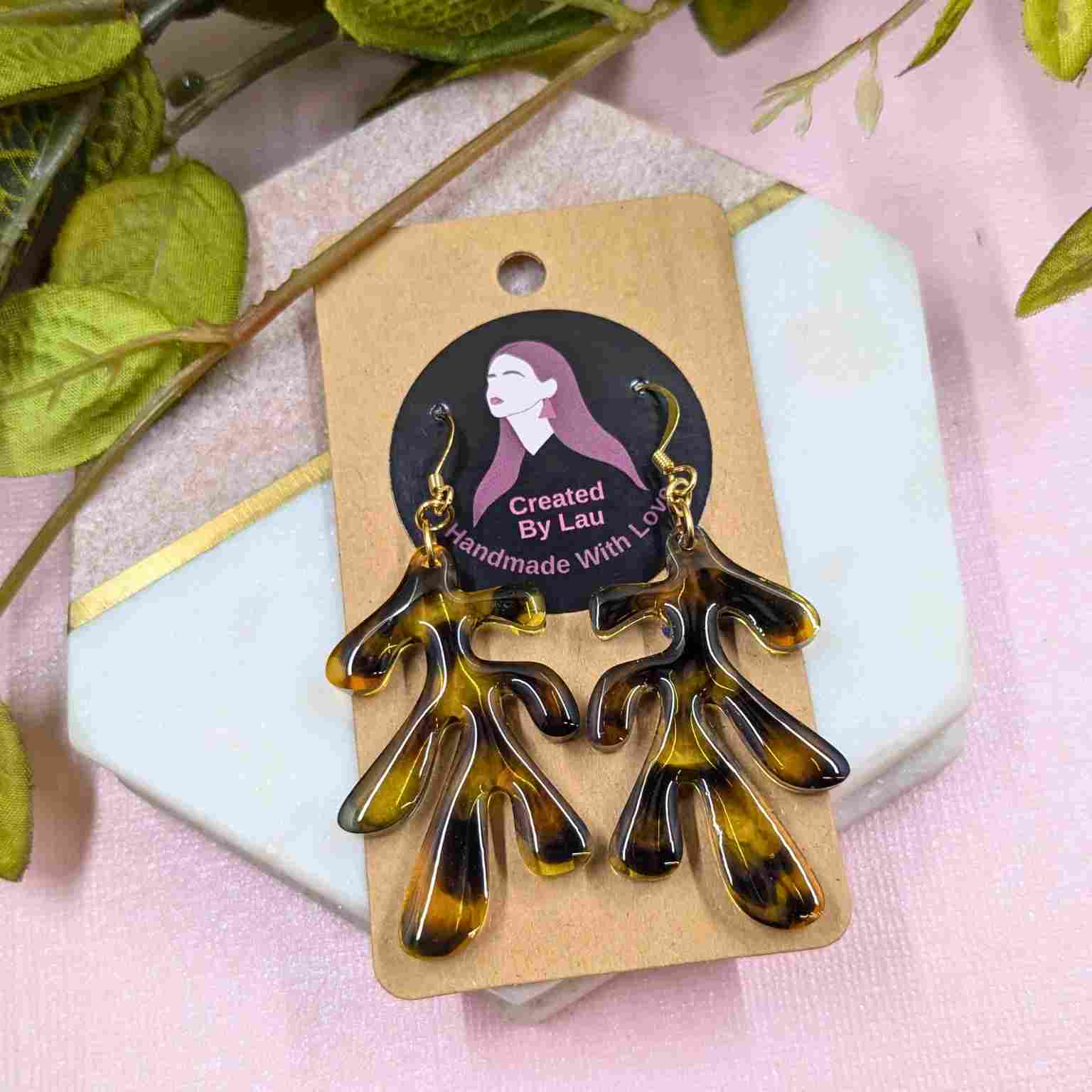 Pair of Dakota Tortoiseshell Resin Organic Leaf Earrings - Gold Plated Hooks on branded packaging