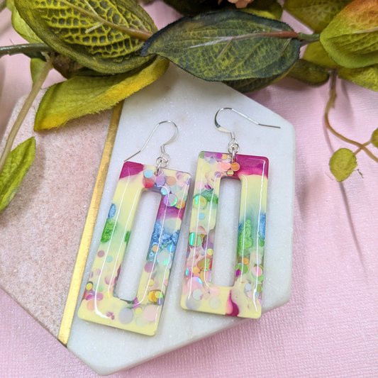 Nora Rainbow Dottie Glitter Rectangle Cut Out Resin Dangle Earrings | Pastel Sparkle by Created By Lau