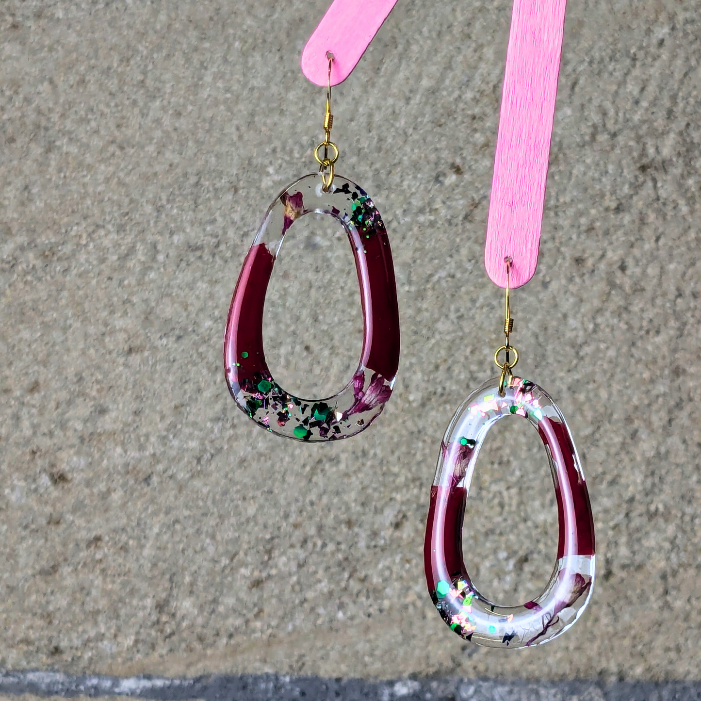 "Rowan" Mulberry Wine Glitter Oval Cutout Resin Dangle Earrings With Real Flowers