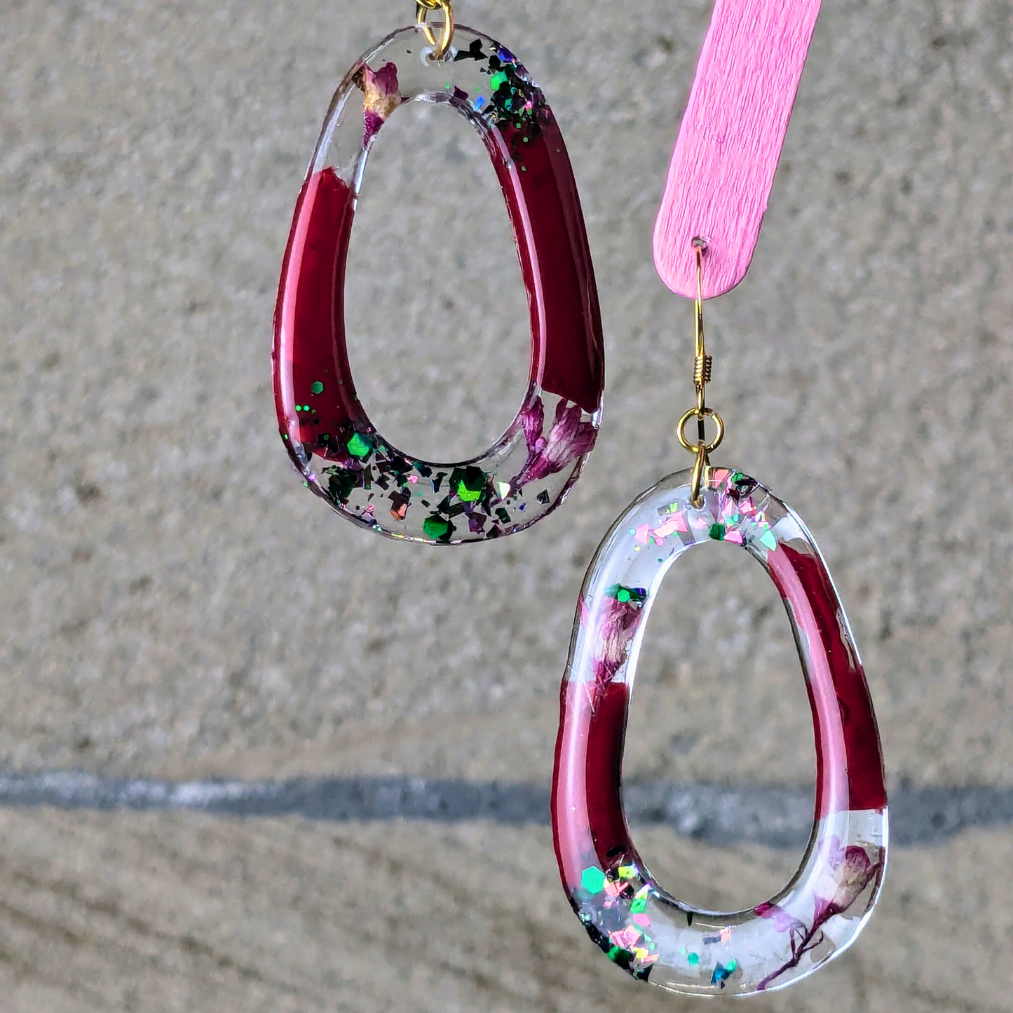 "Rowan" Mulberry Wine Glitter Oval Cutout Resin Dangle Earrings With Real Flowers