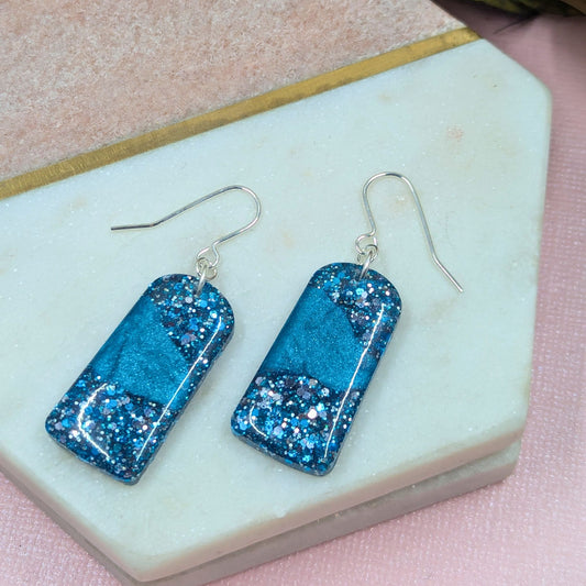 "Sarai" Blue Metallic Glitter Resin Arch Earrings