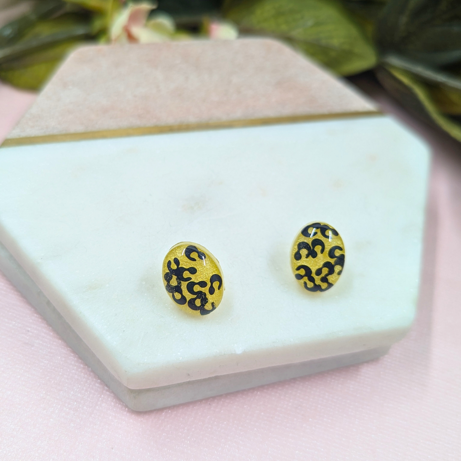 Hattie black animal print glitter resin stud earrings with yellow background handmade in Yorkshire