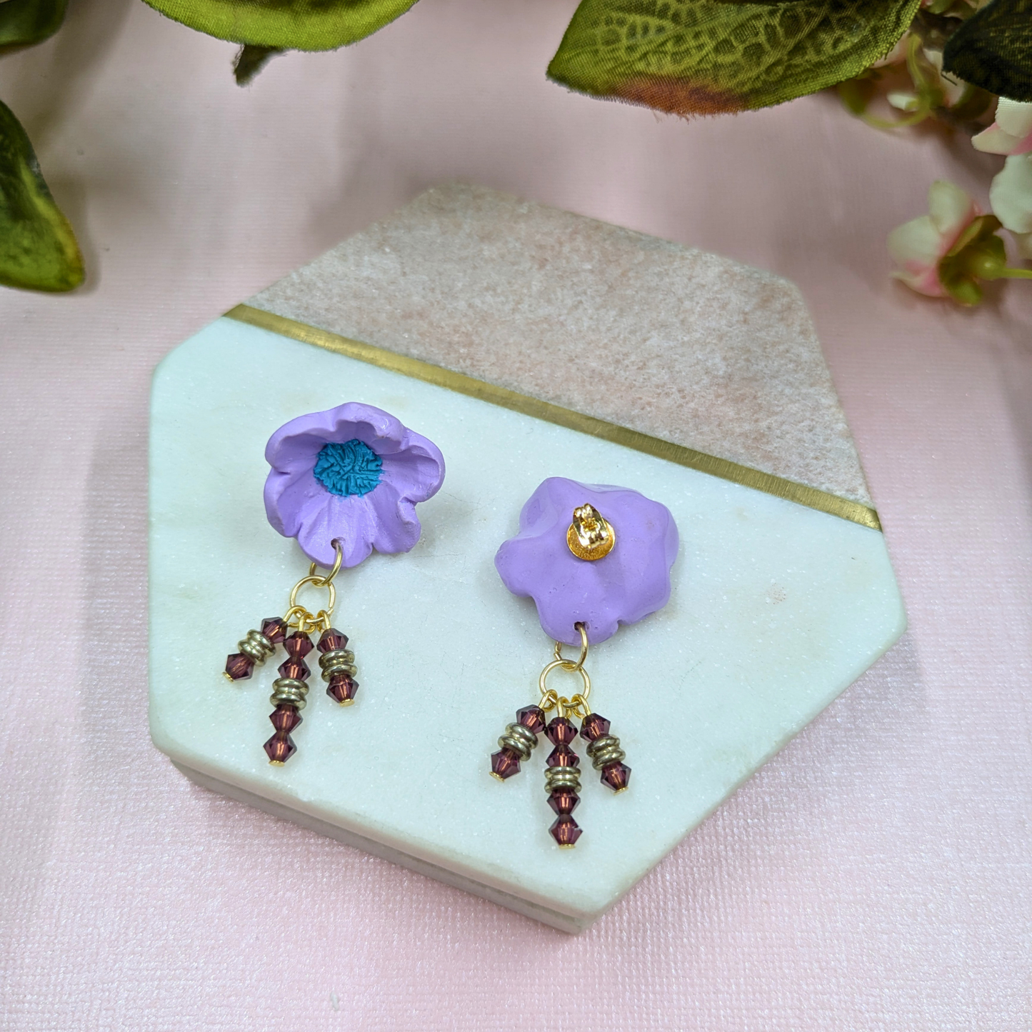 Pair of Beatrix purple statement earrings from Resurrection Collection