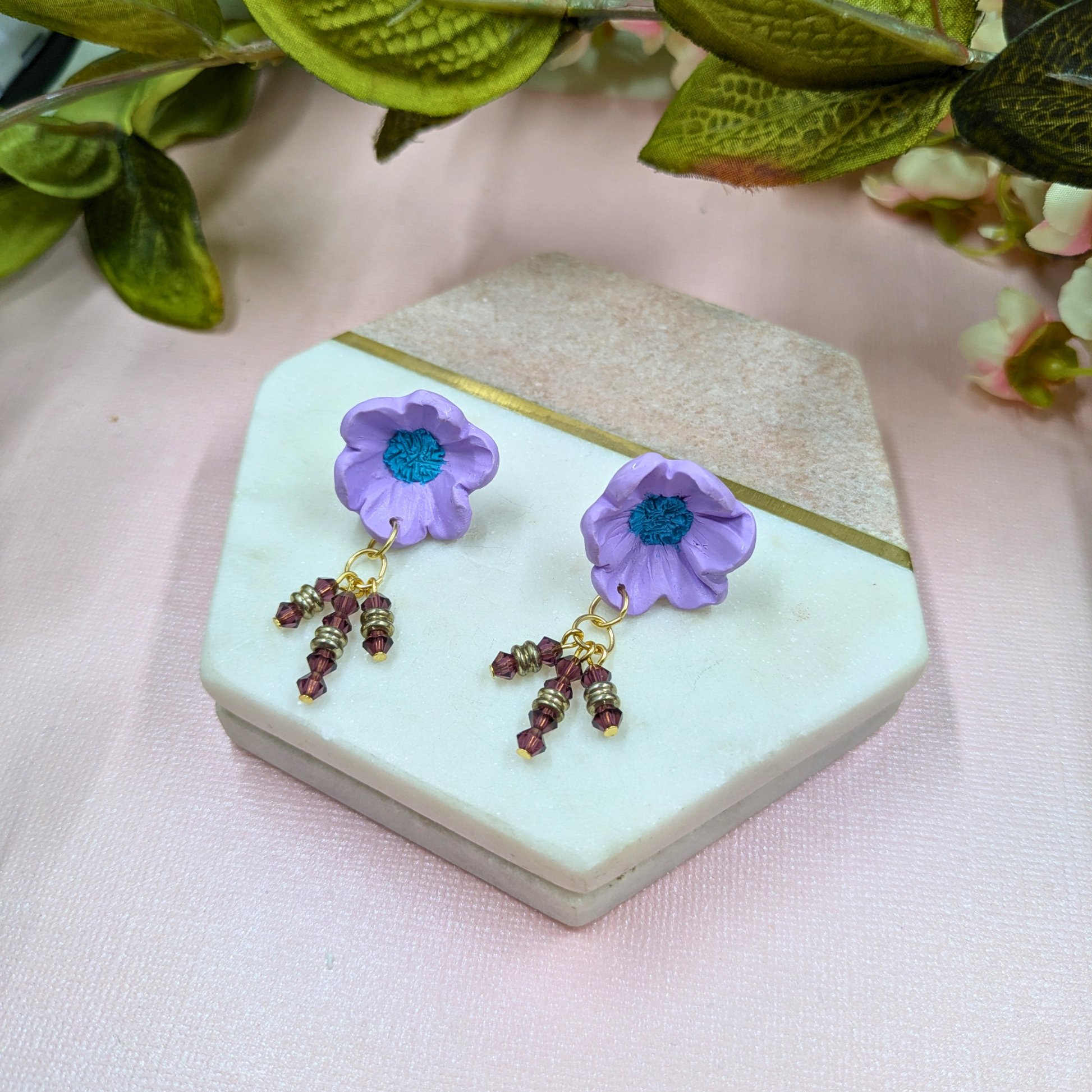 Triple chain dangle showing movement on Beatrix unique earrings