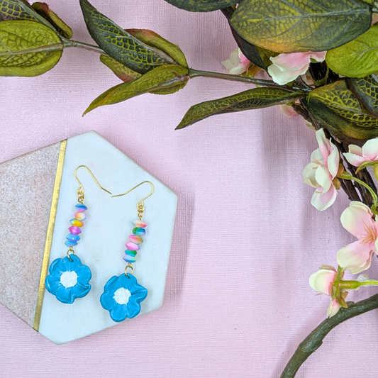 Front view of Elara handmade blue polymer clay flower earrings artisan style