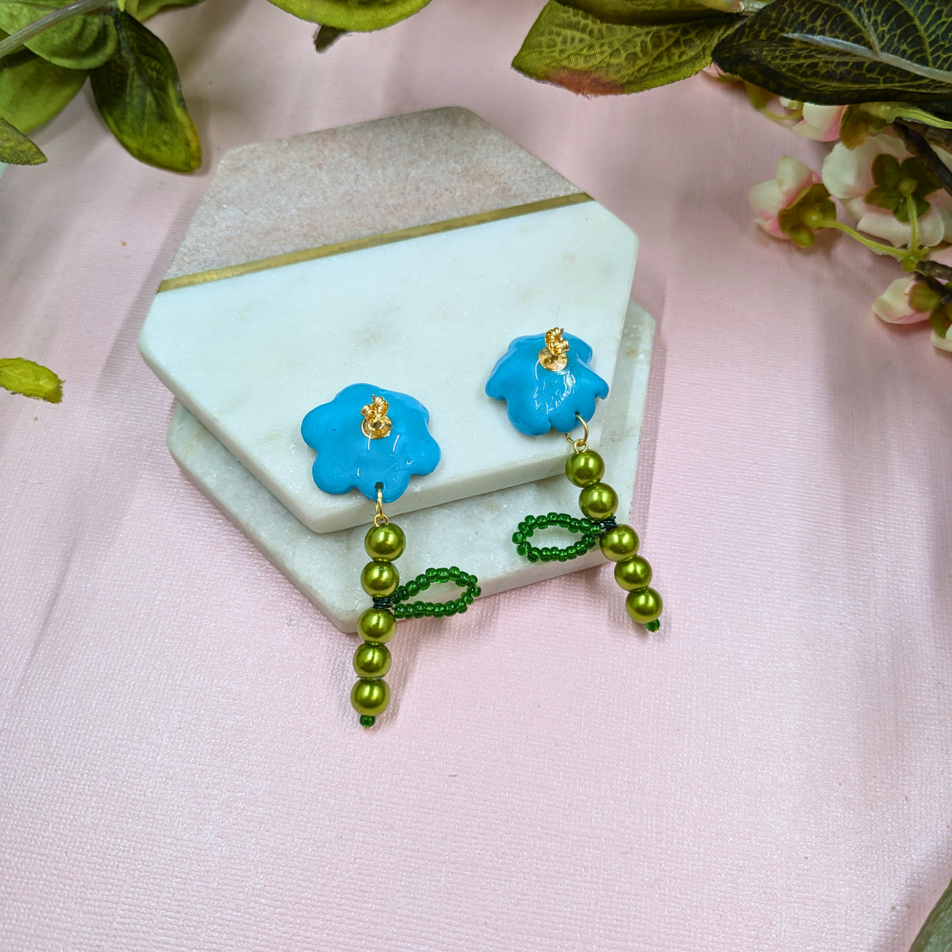 back of leafed stem design on Fern earrings with recycled green glass beads showing gold plated studs