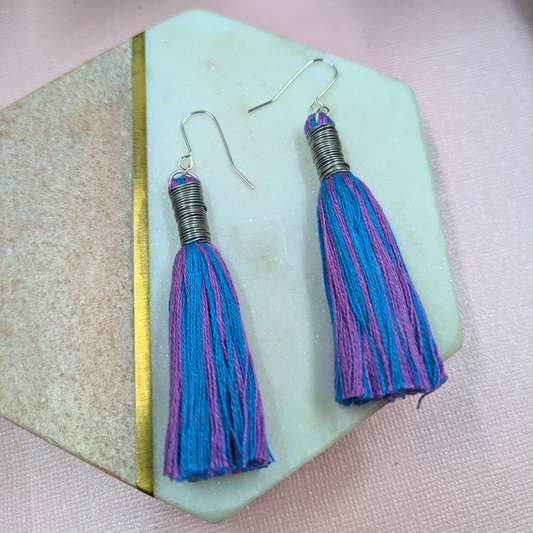Close-up of handmade wire wrap detail on Roxie tassel earrings