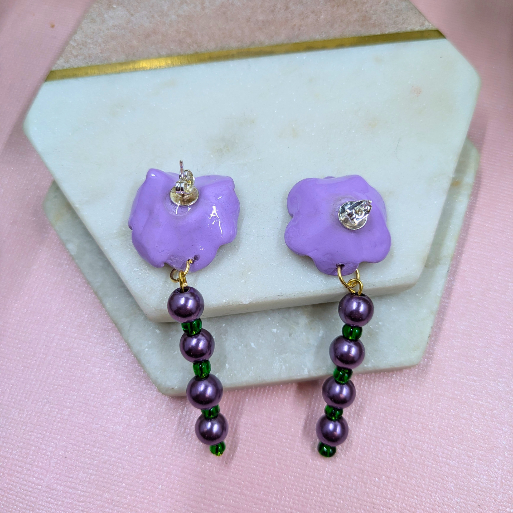Back of Sylvie purple flower earrings with recycled pearls and green glass with silver plated studs